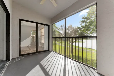 a view of a balcony from an empty room