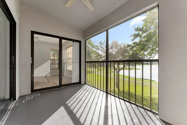 a view of a balcony from an empty room