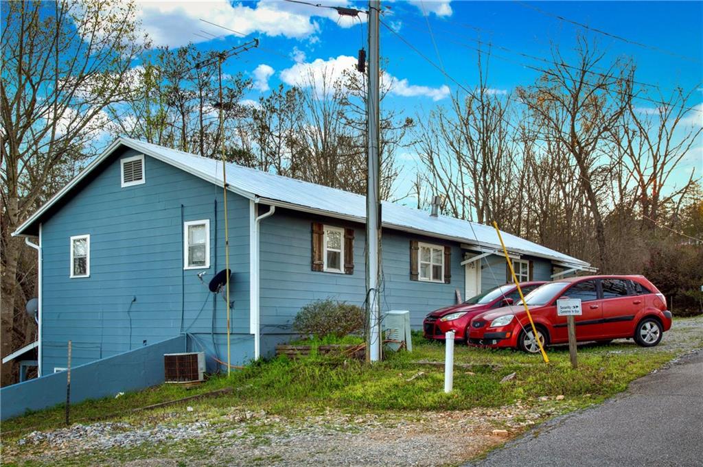 120 Bear Ridge Road Dahlonega, GA 30533 - Photo 1 of 7 a house view with a garden space