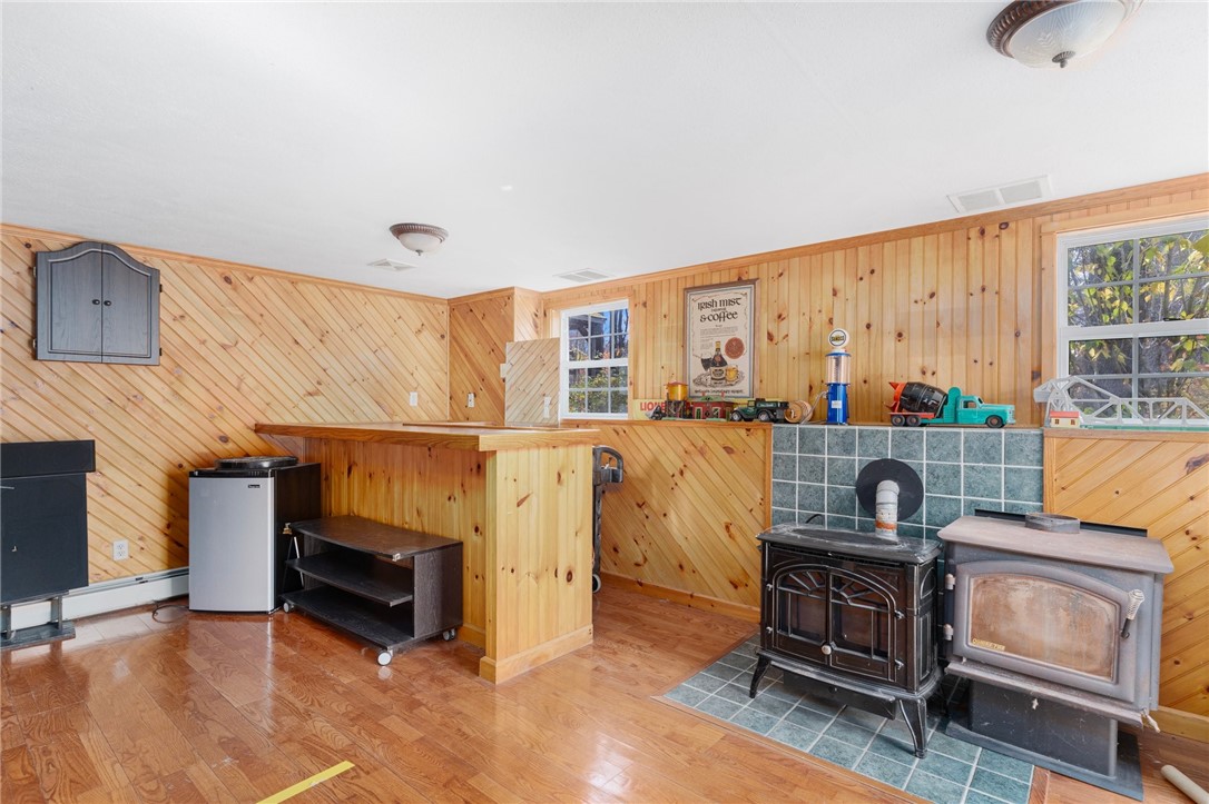 300 Donahue Road Burrillville, RI 02859 - Photo 37 of 47 Finished basement Recreation Room with Pellet Stove