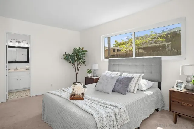 a bedroom with bed and window