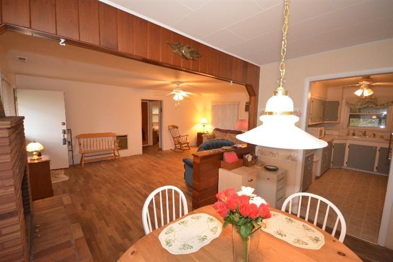 4178 Grant Road Central Point, OR 97502 - Photo 8 of 11 a dining room with furniture and wooden floor