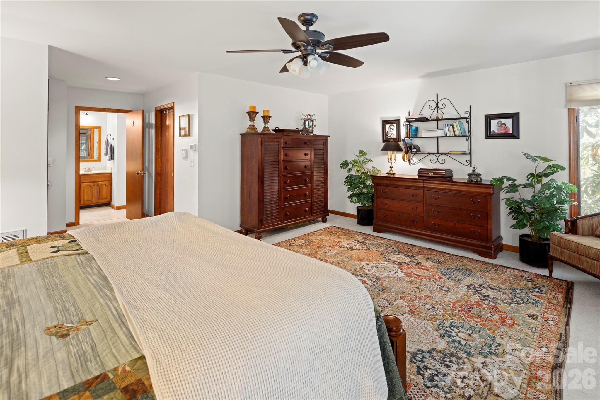 119 Rome Court Lake Lure, NC 28746 - Photo 17 of 31 a bedroom with a bed dresser and a window