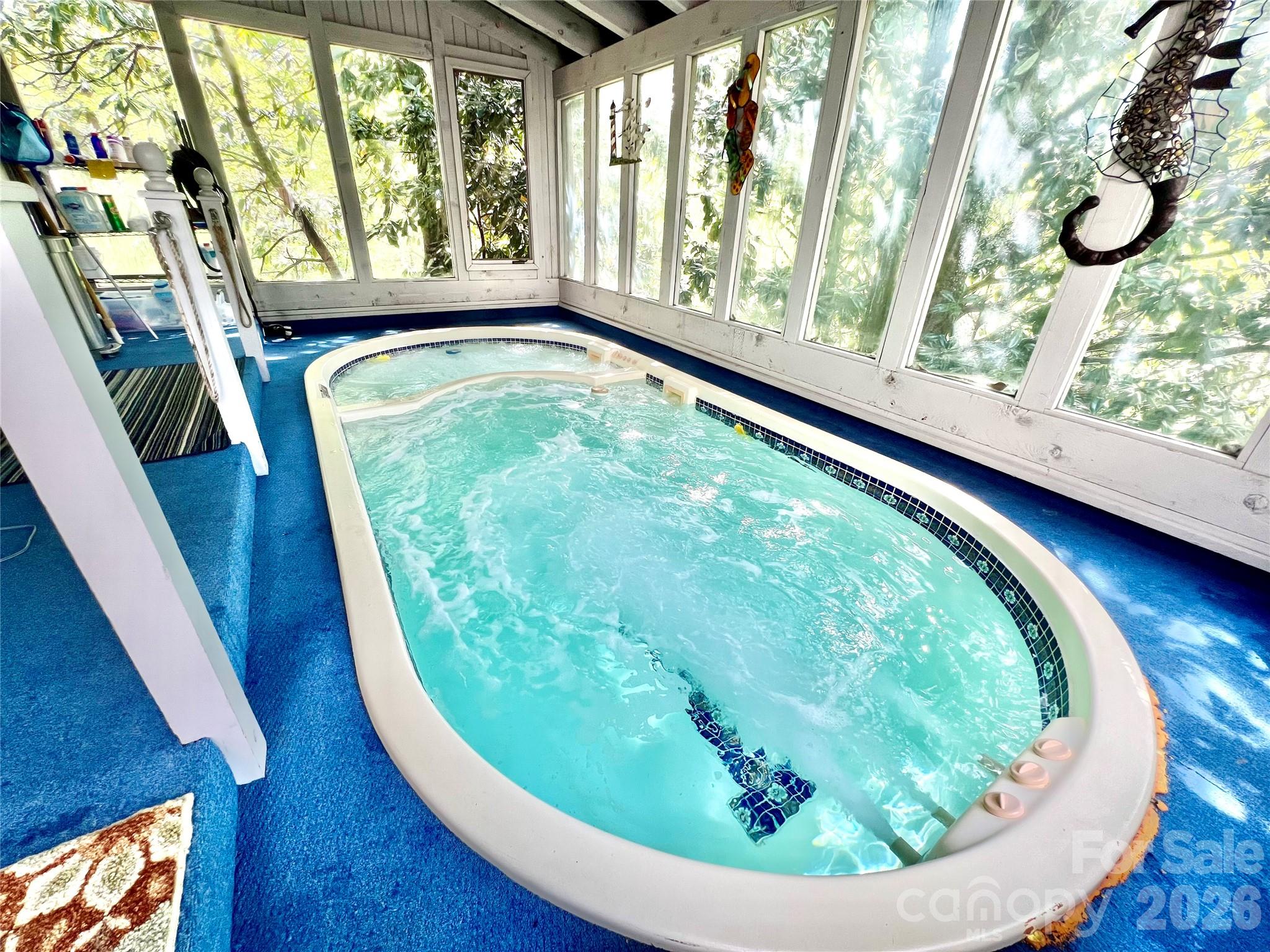 119 Rome Court Lake Lure, NC 28746 - Photo 19 of 31 a view of a floor to ceiling window and wooden floor
