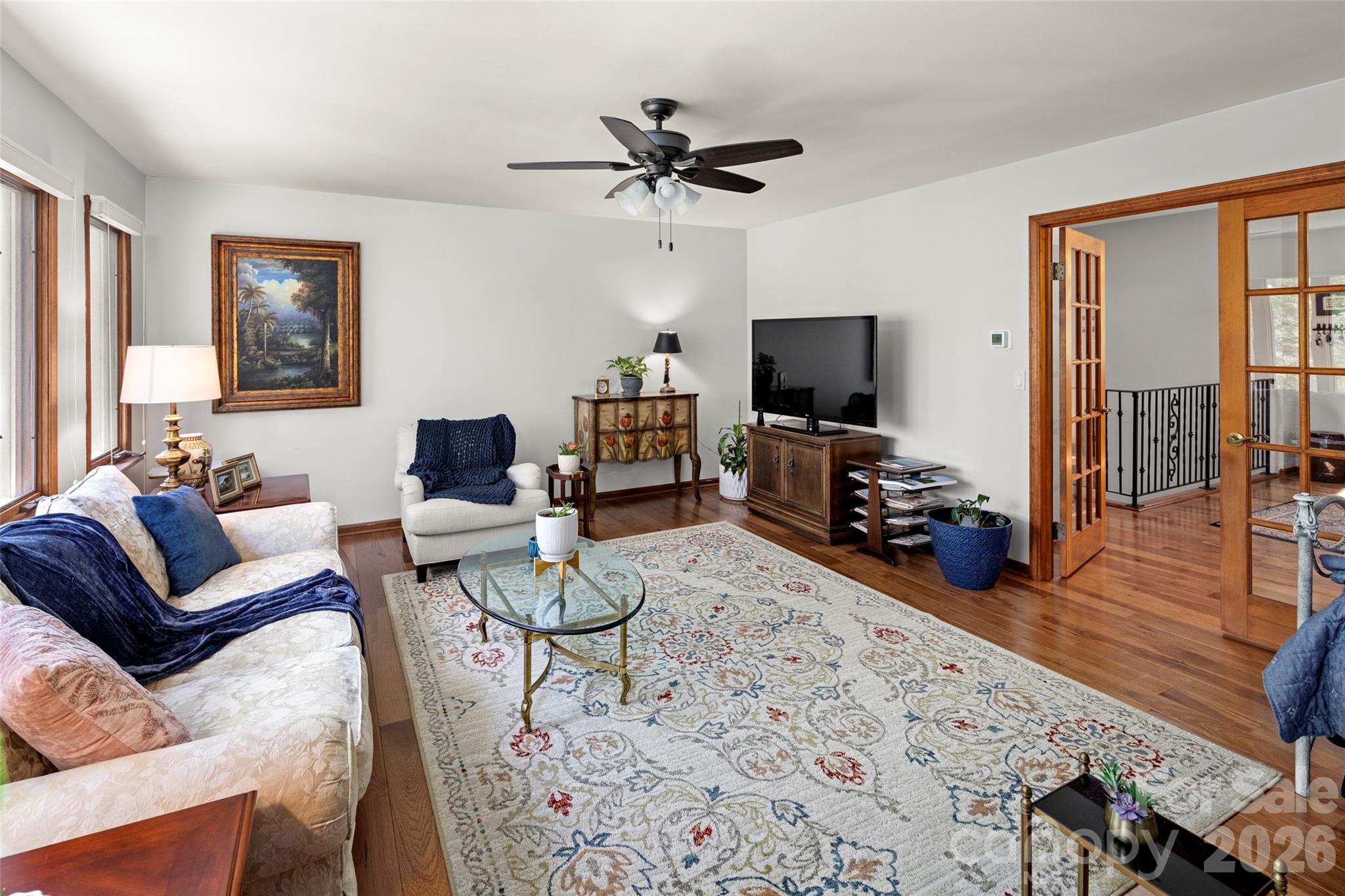 119 Rome Court Lake Lure, NC 28746 - Photo 5 of 31 a living room with furniture and a flat screen tv with wooden floor