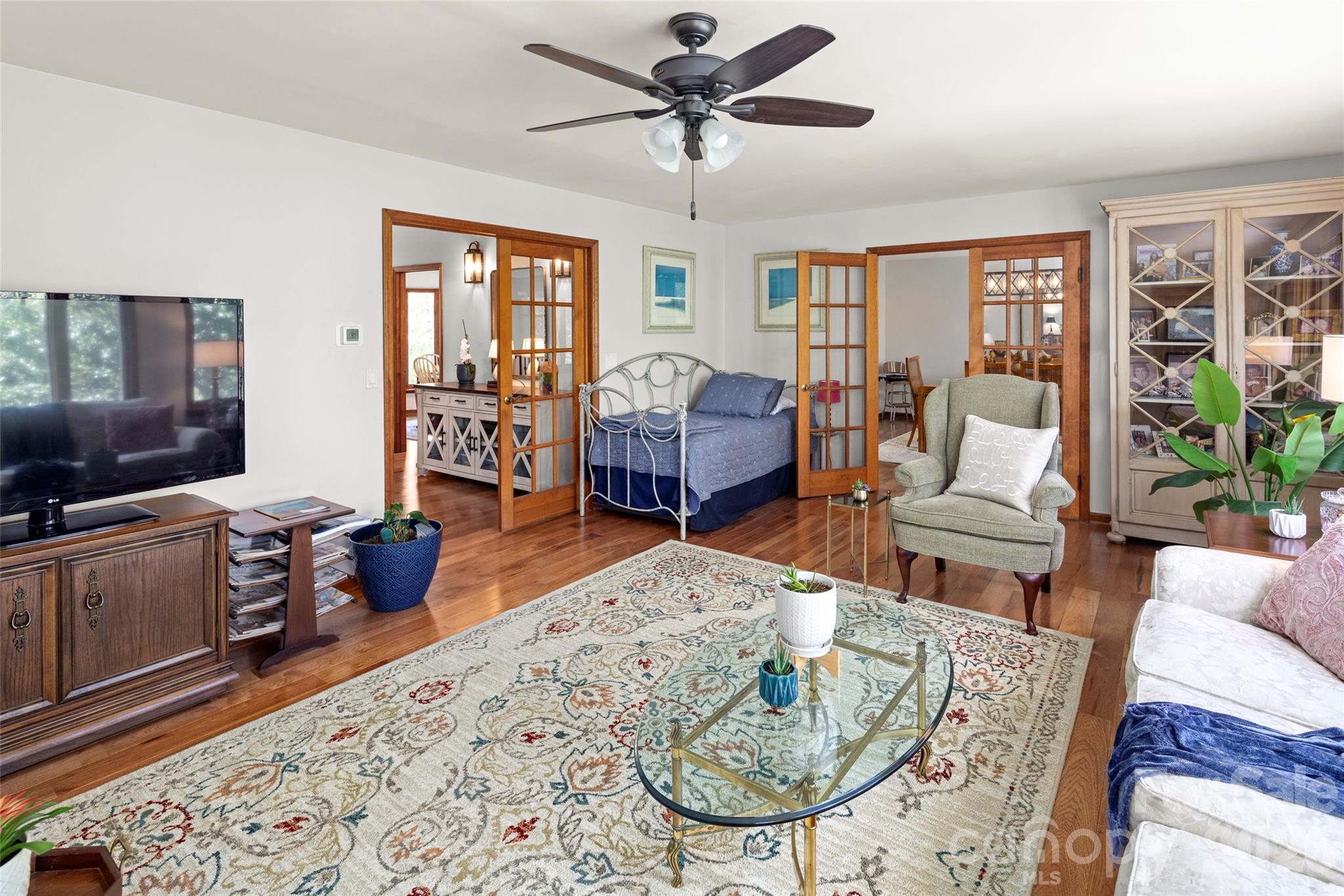 119 Rome Court Lake Lure, NC 28746 - Photo 7 of 31 a living room with furniture fireplace and a flat screen tv