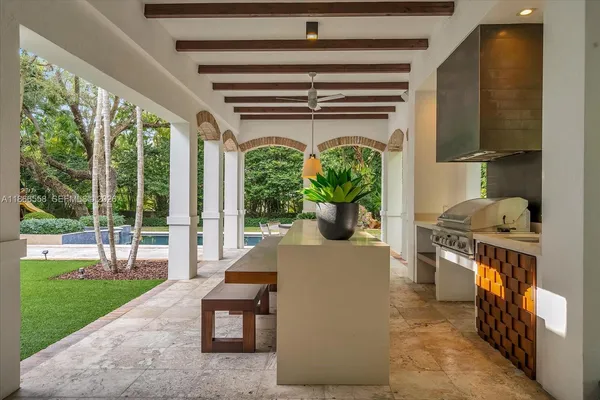 a living room with furniture and a porch