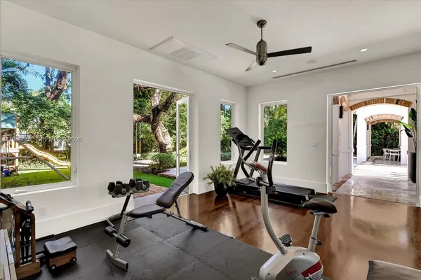 a view of a livingroom with workspace and a window