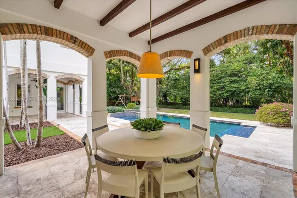 a view of a patio with a table chairs and a table