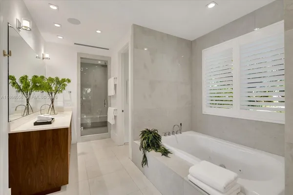 a bathroom with a bathtub and a sink