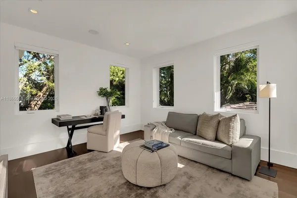 a living room with furniture and a large window