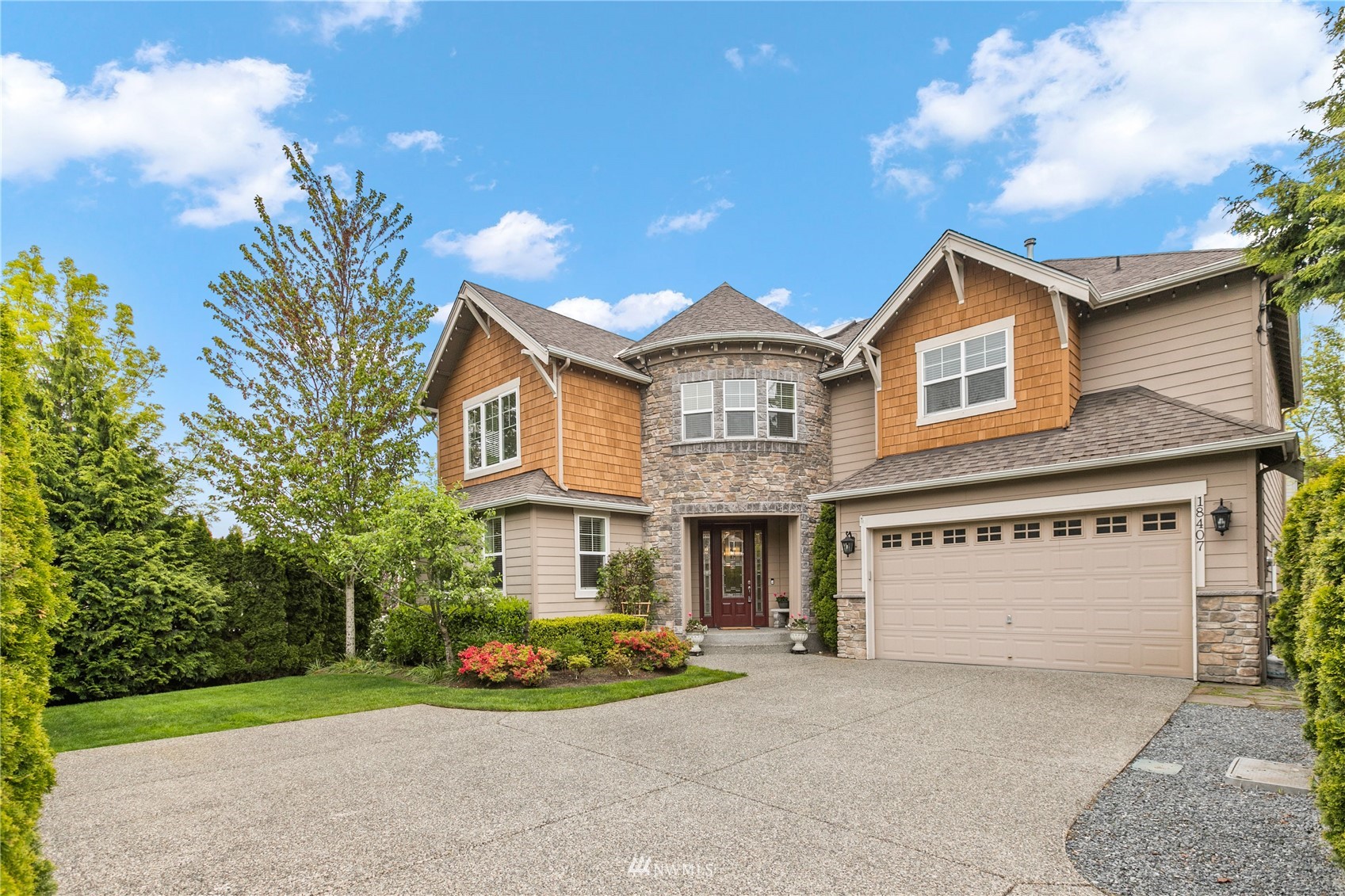 18407 36th Avenue Southeast Bothell, WA 98012 - Photo 1 of 39 a front view of a house with a yard and garage