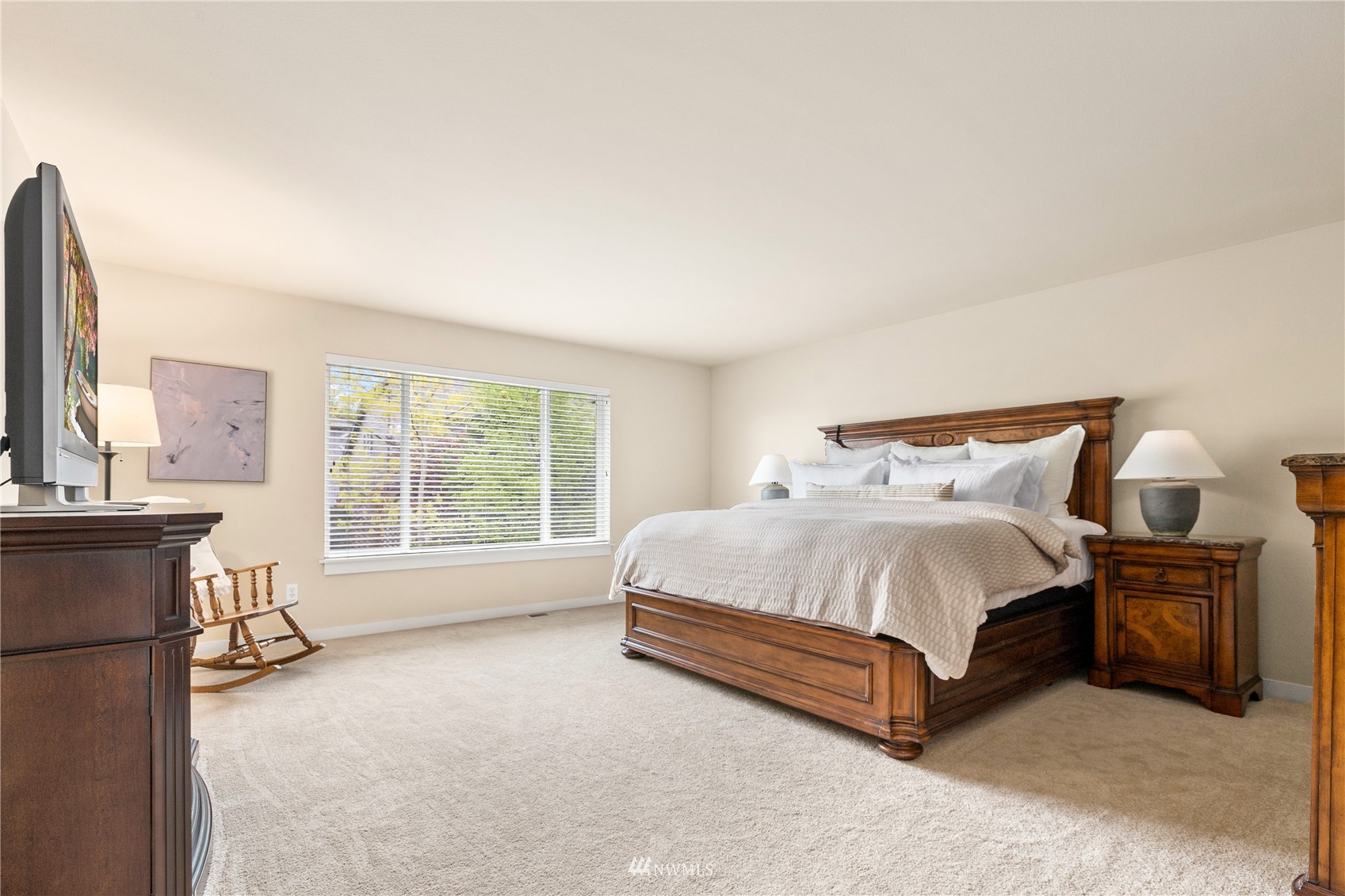 18407 36th Avenue Southeast Bothell, WA 98012 - Photo 18 of 39 a bed sitting in a bedroom next to a window