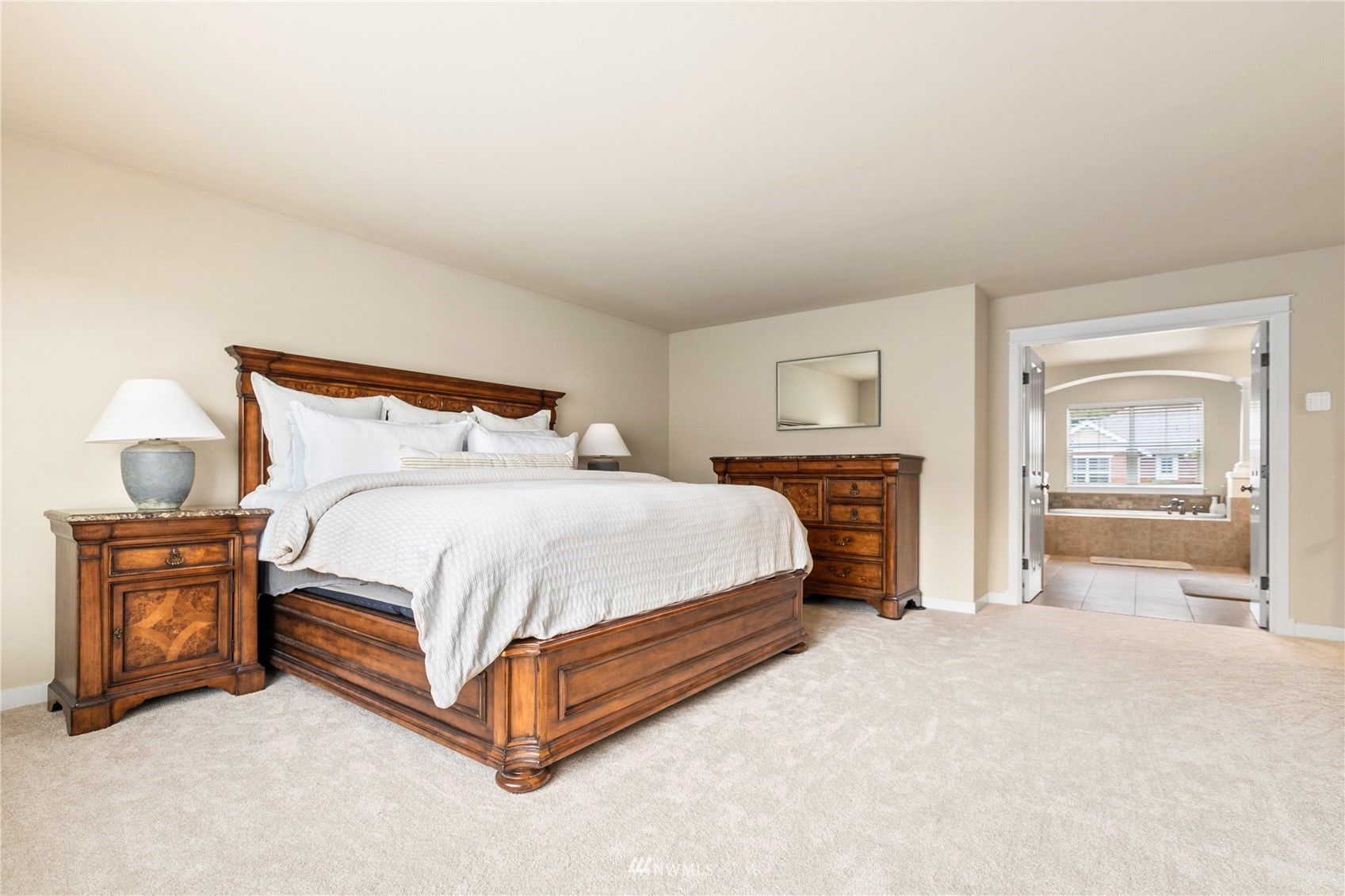18407 36th Avenue Southeast Bothell, WA 98012 - Photo 19 of 39 a spacious bedroom with a bed and a tv