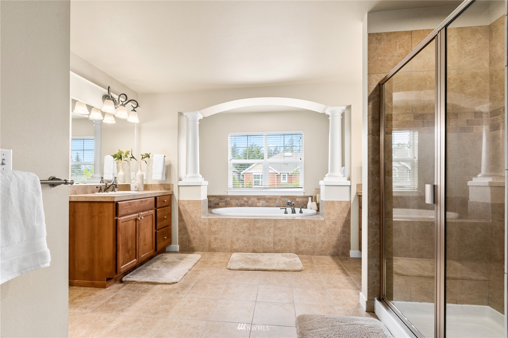18407 36th Avenue Southeast Bothell, WA 98012 - Photo 20 of 39 a large bathroom with a glass door shower and sink