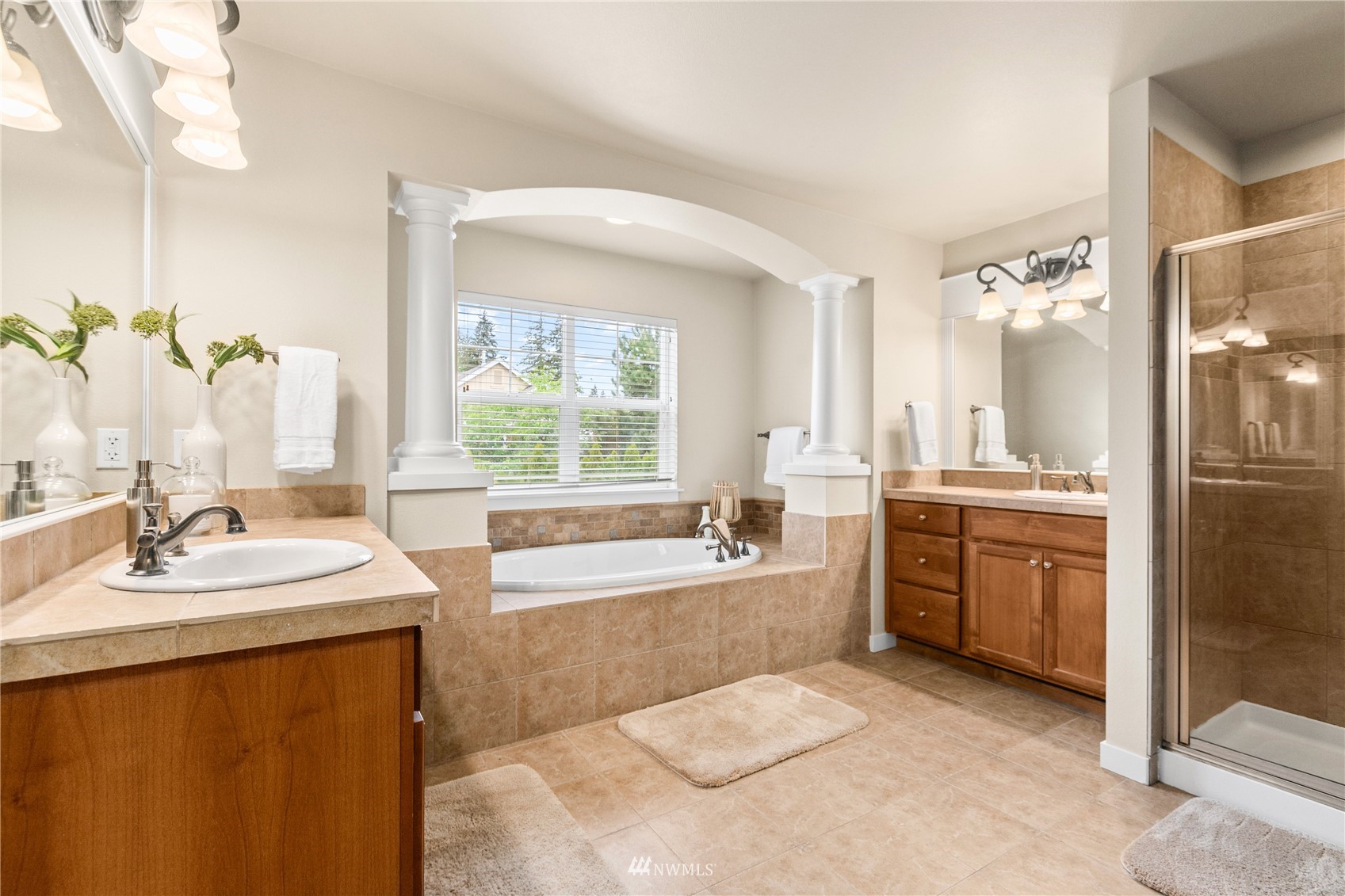 18407 36th Avenue Southeast Bothell, WA 98012 - Photo 21 of 39 a spacious bathroom with sink shower bathtub and window