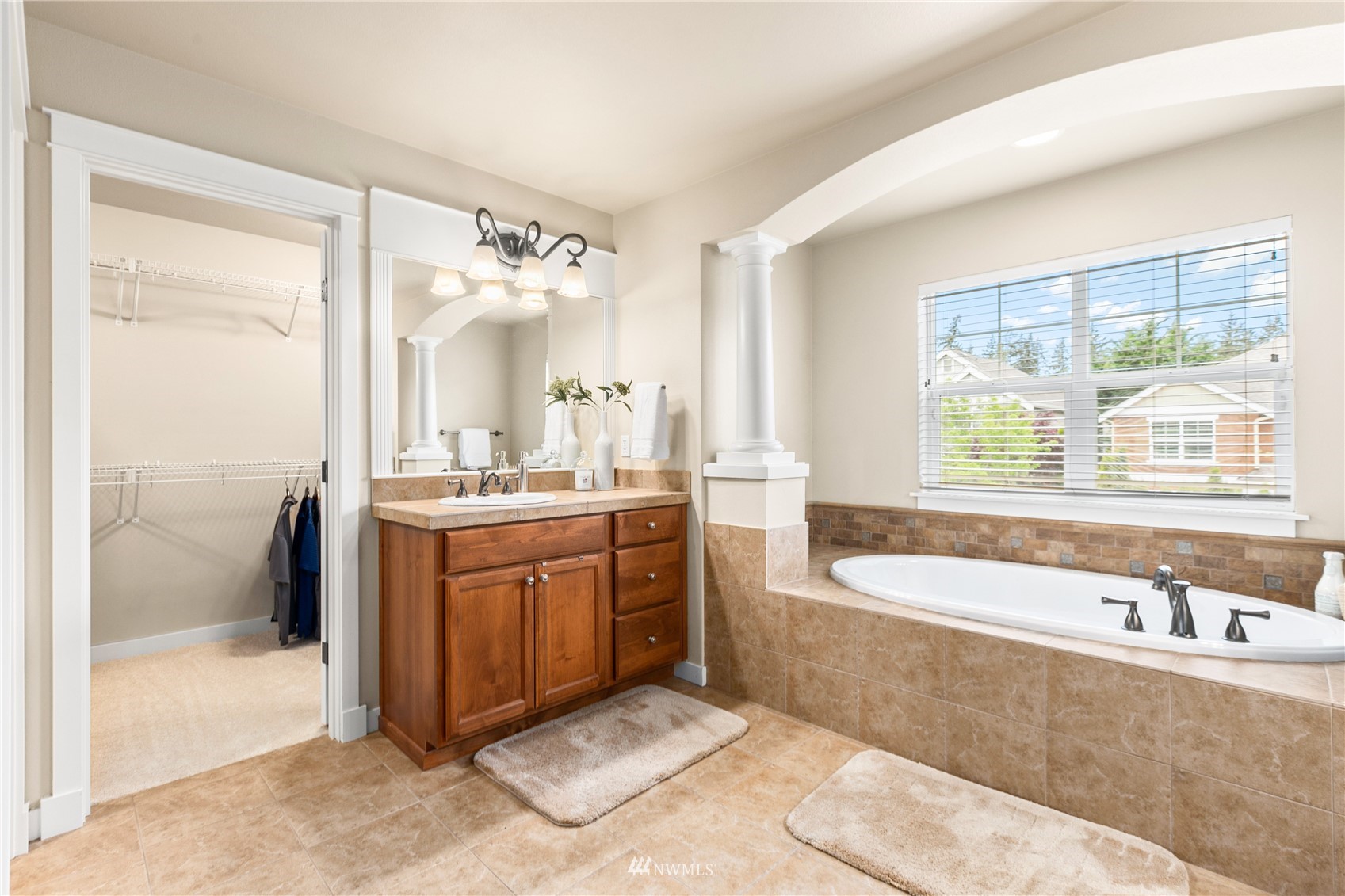 18407 36th Avenue Southeast Bothell, WA 98012 - Photo 22 of 39 a spacious bathroom with a tub sink and mirror