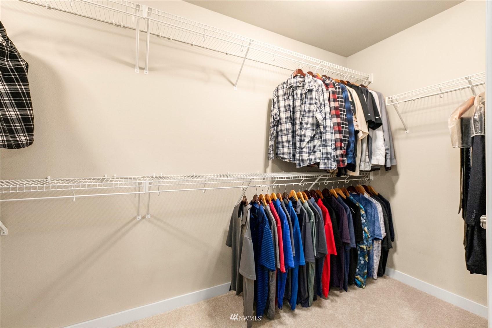 18407 36th Avenue Southeast Bothell, WA 98012 - Photo 23 of 39 a view of walk in closet with clothes and shoes