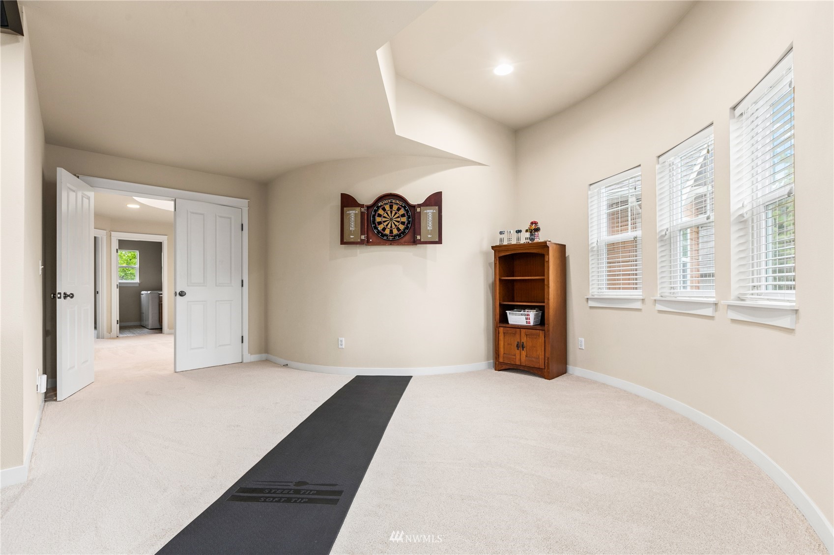 18407 36th Avenue Southeast Bothell, WA 98012 - Photo 30 of 39 a bedroom with a bed and a large mirror