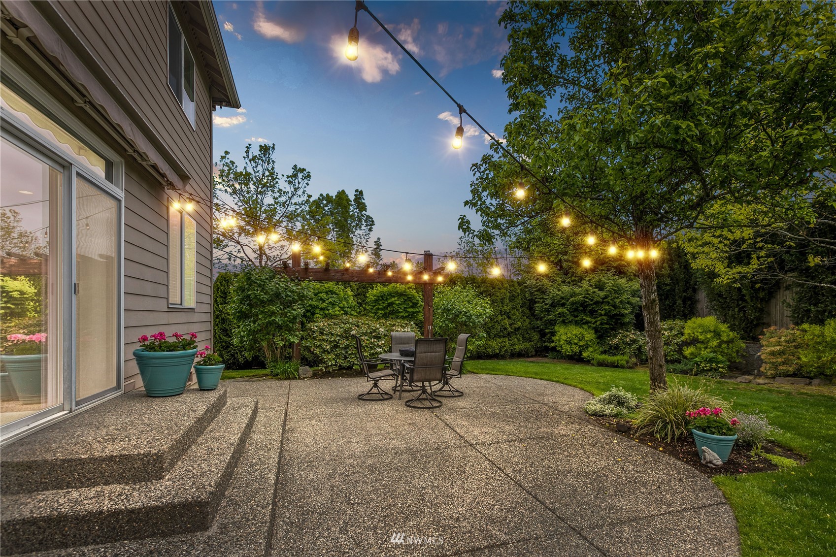 18407 36th Avenue Southeast Bothell, WA 98012 - Photo 34 of 39 a view of a patio with chairs and potted plants
