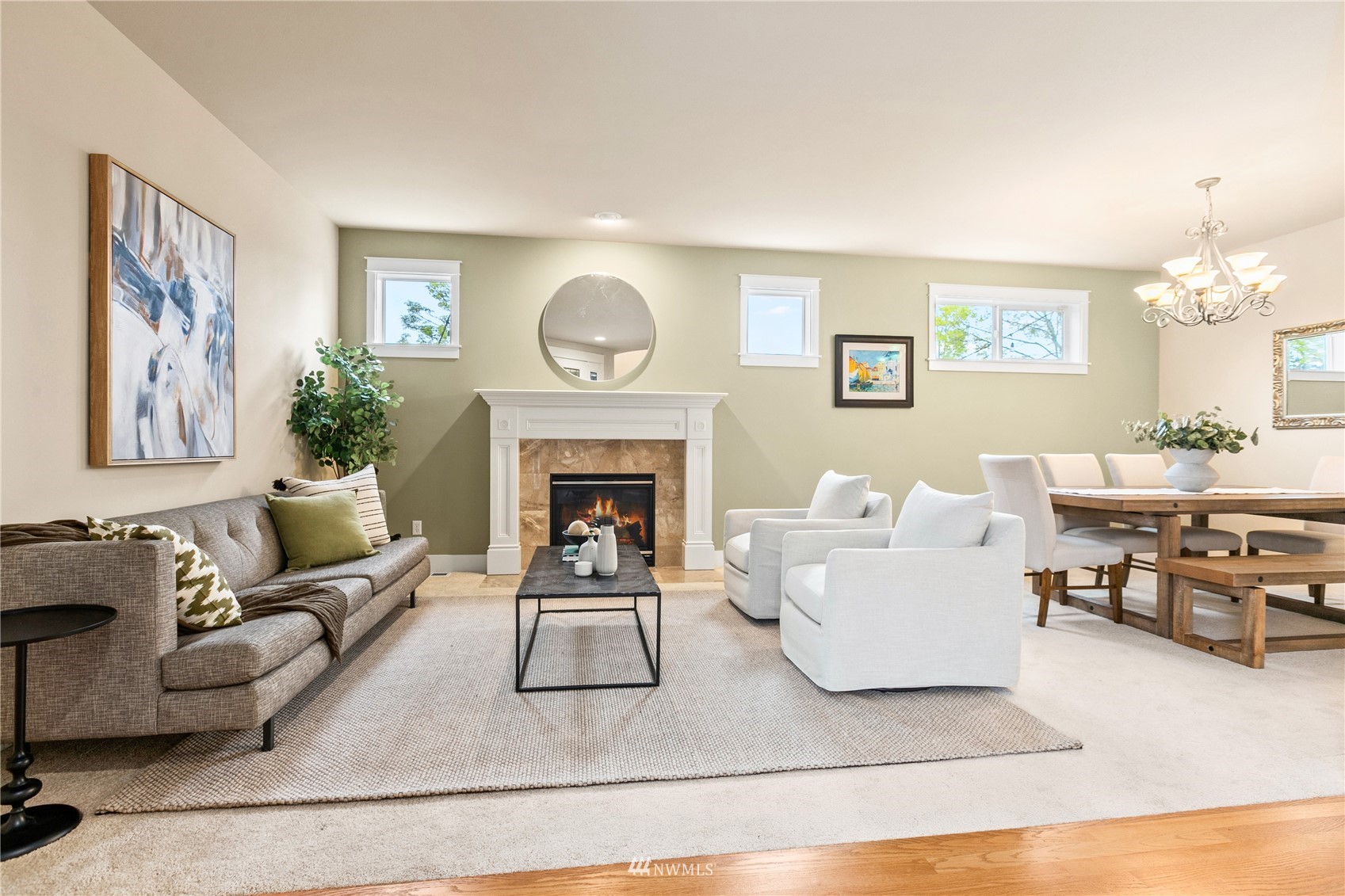 18407 36th Avenue Southeast Bothell, WA 98012 - Photo 5 of 39 a living room with furniture a clock and a fireplace