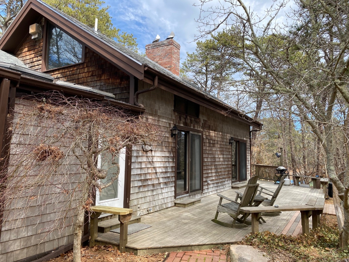 11 Sengekontacket Road Oak Bluffs, MA 02557 - Photo 4 of 19 Expansive deck along the entire south side -large glass sliders provide easy access from dining and living rooms and the den.