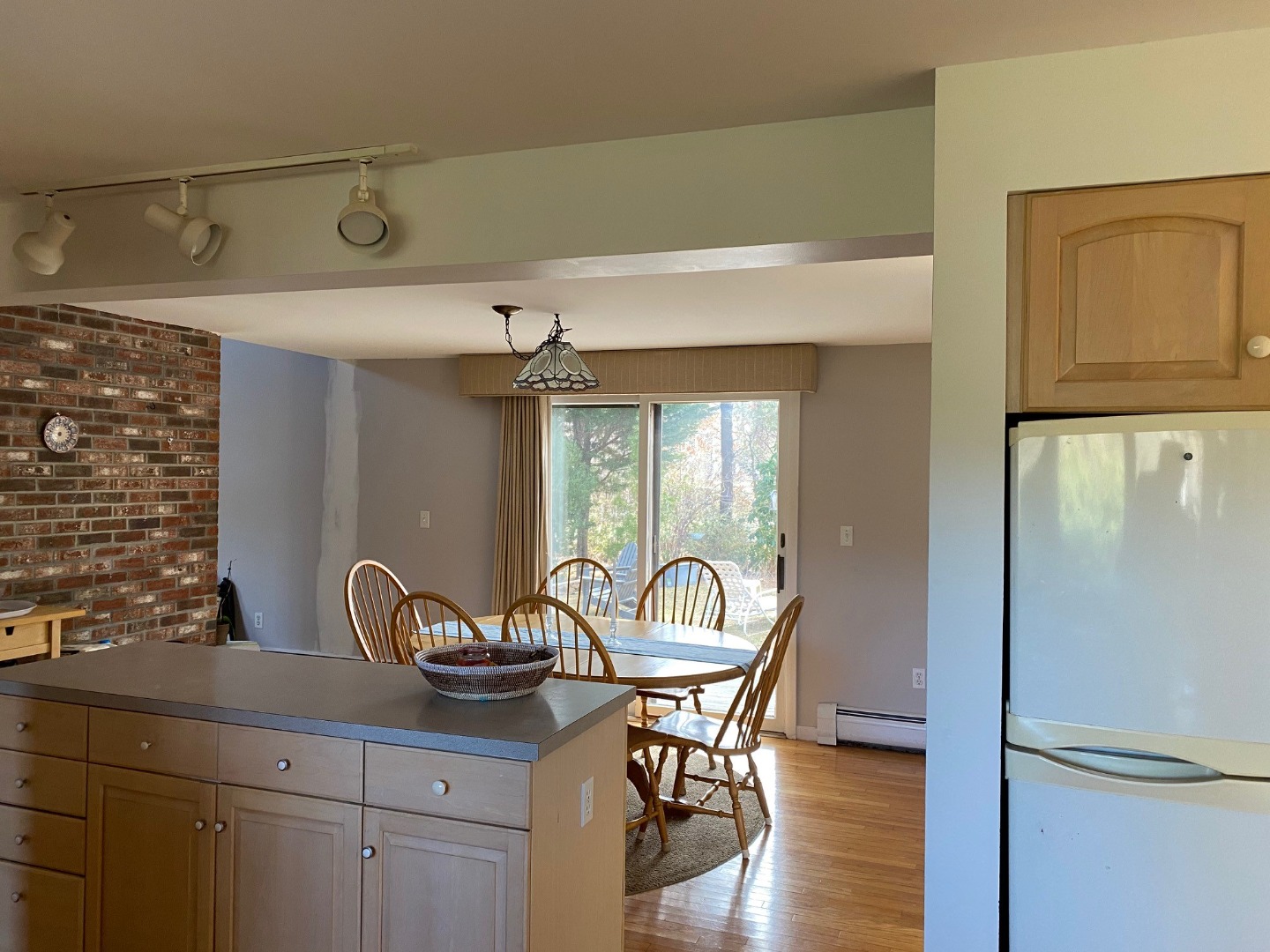 11 Sengekontacket Road Oak Bluffs, MA 02557 - Photo 6 of 19 Kitchen looking past center island toward dining area and through the sliding doors to the deck.