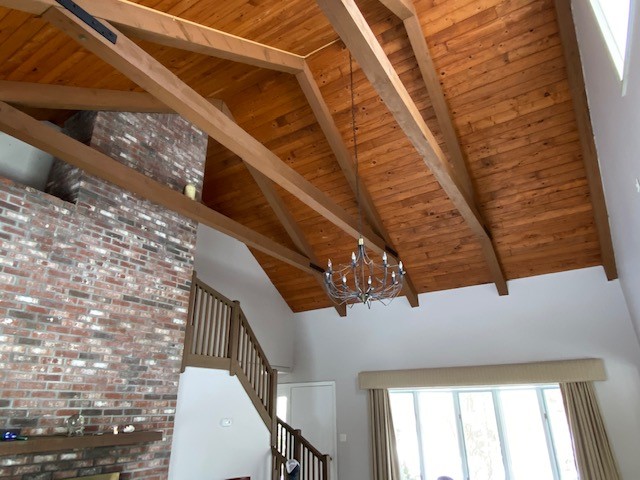 11 Sengekontacket Road Oak Bluffs, MA 02557 - Photo 7 of 19 Dramatic living room/great room with brick fireplace and beamed cathedral ceilings. Stairs to enclosed loft.