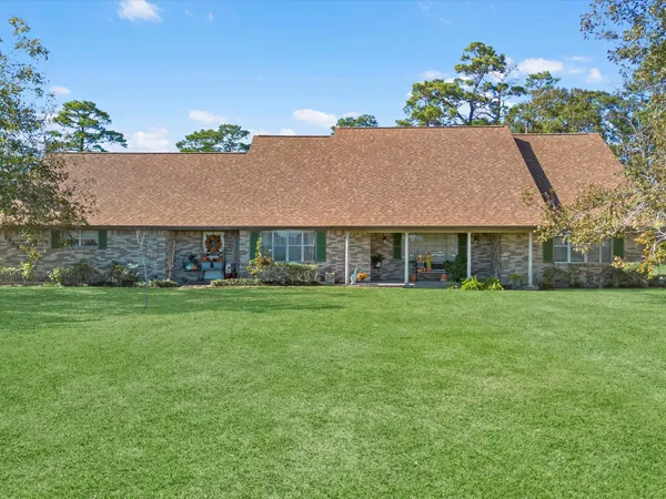 a view of a house with a big yard