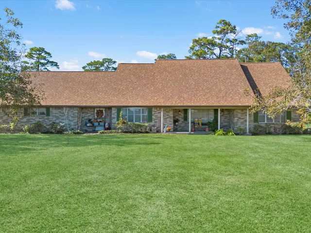 a view of a house with a big yard