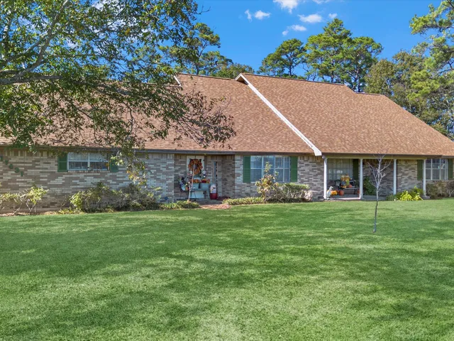 a house with a tree in front of it
