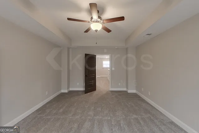 a bathroom with a granite countertop sink mirror and shower