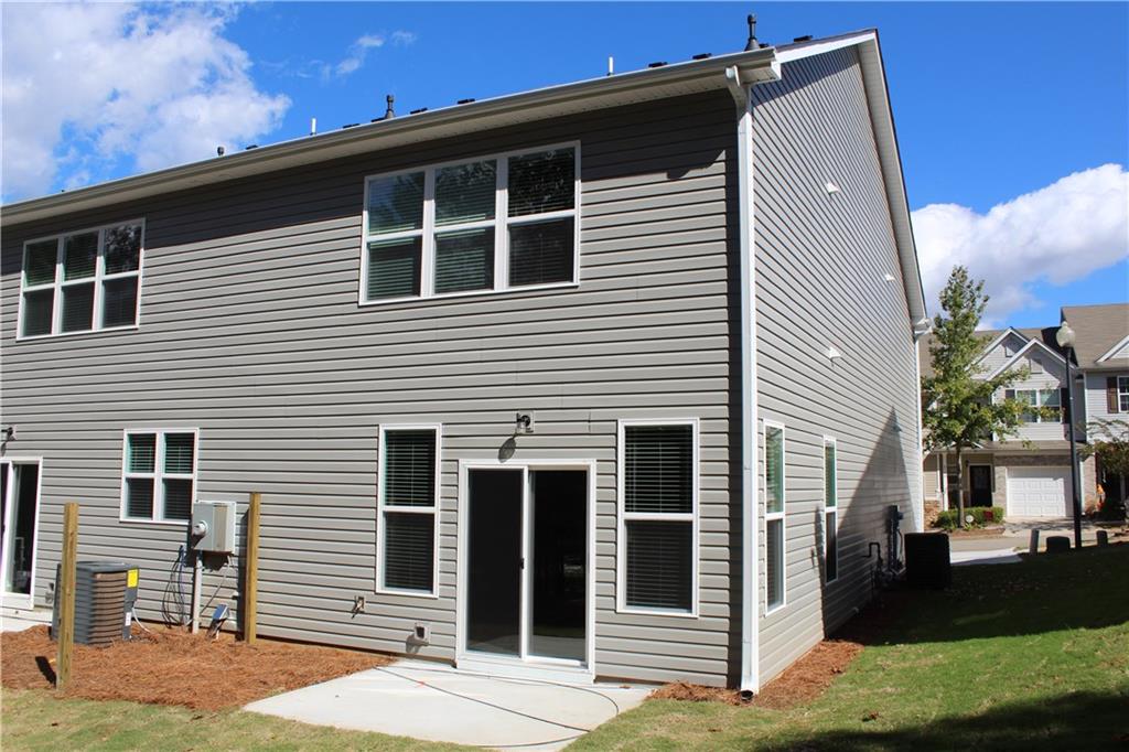 4741 Beacon Ridge Lane Flowery Branch, GA 30542 - Photo 12 of 15 a front view of a house with a yard