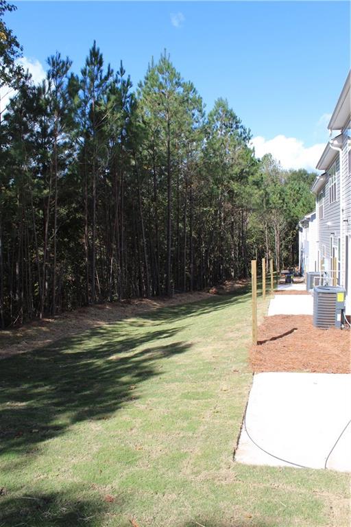 4741 Beacon Ridge Lane Flowery Branch, GA 30542 - Photo 13 of 15 a swimming pool with wooden fence