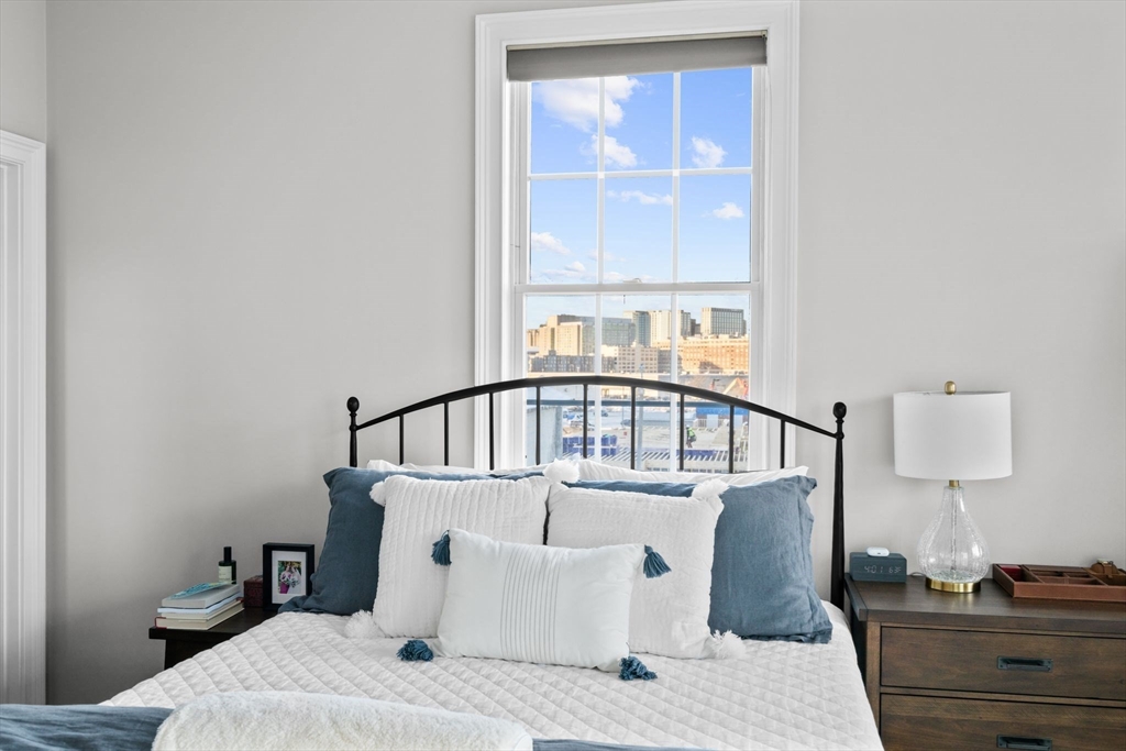 34 H Street, Unit 2L Boston, MA 02127 - Photo 14 of 20 a view of a bedroom with furniture and a window