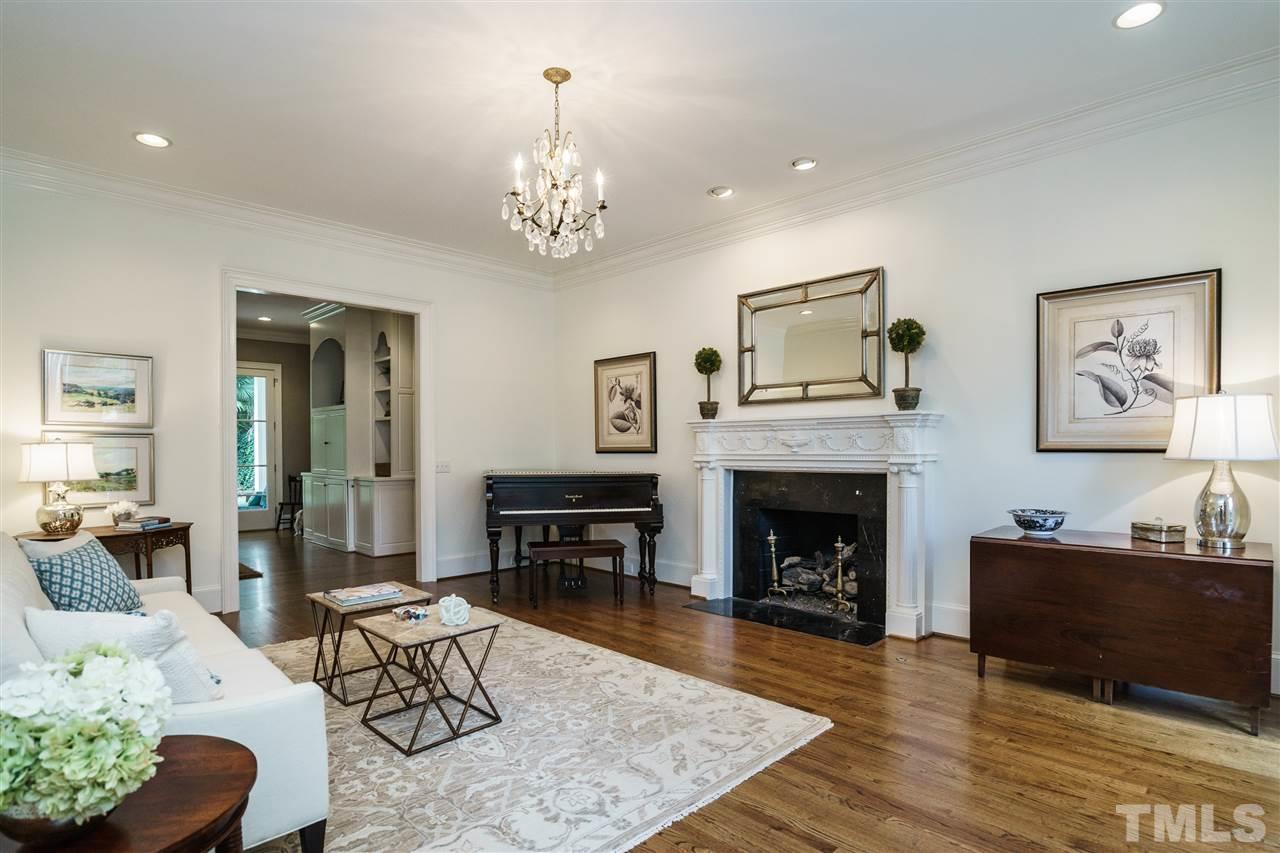 312 Forsyth Street Raleigh, NC 27609 - Photo 3 of 25 a living room with furniture and a fireplace