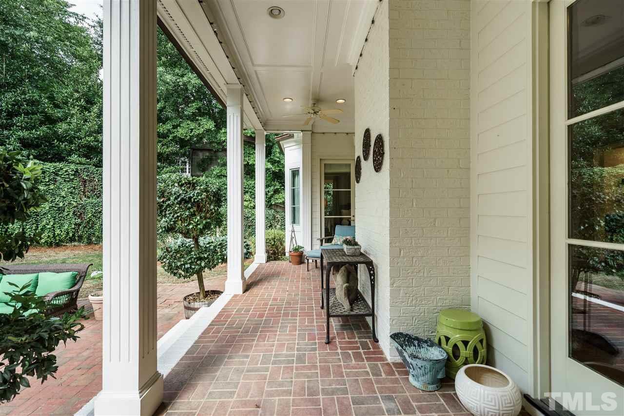 312 Forsyth Street Raleigh, NC 27609 - Photo 22 of 25 a hallway with wooden floor and a potted plant