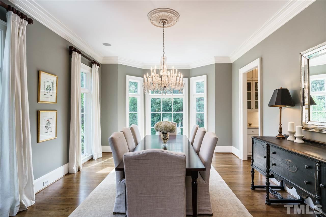312 Forsyth Street Raleigh, NC 27609 - Photo 4 of 25 a view of a dining room with furniture window and wooden floor