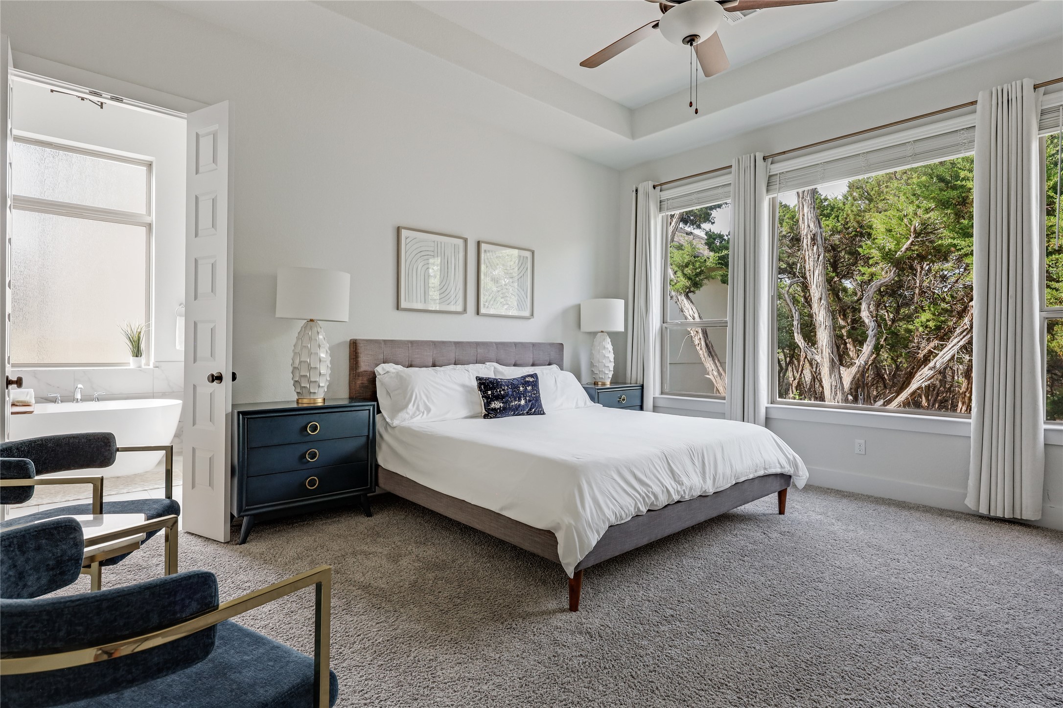 4905 Destination Way Jonestown, TX 78645 - Photo 11 of 27 a spacious bedroom with a bed and a large window