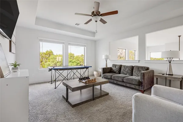 a living room with furniture and a large window