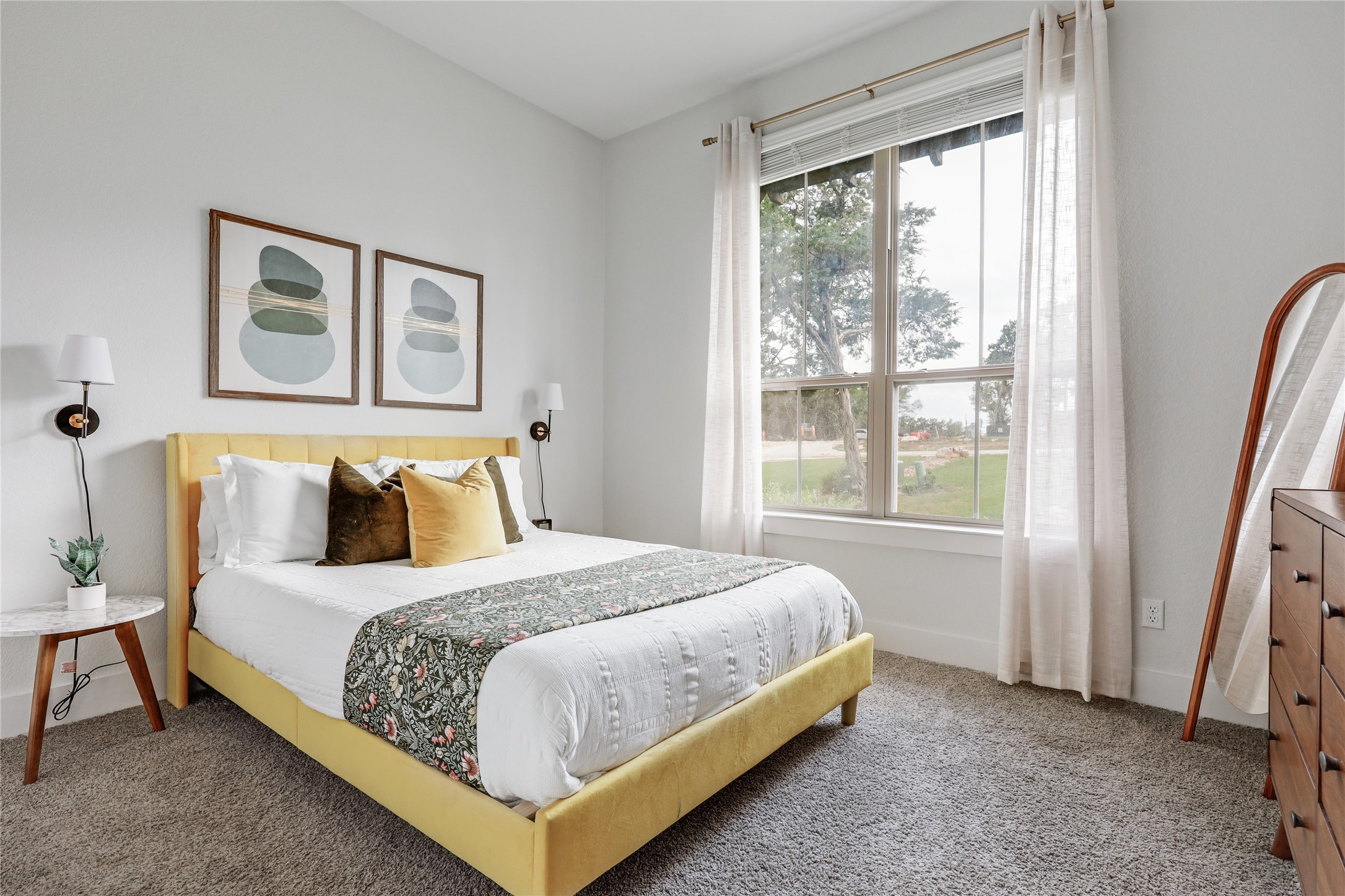 4905 Destination Way Jonestown, TX 78645 - Photo 17 of 27 a bedroom with a bed lamp and a window