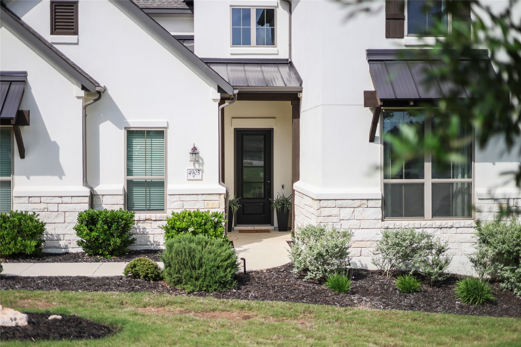 4905 Destination Way Jonestown, TX 78645 - Photo 2 of 27 front view of a house with a yard