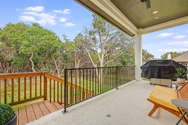 a view of a balcony with chairs