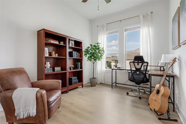 a view of a livingroom with furniture and a window