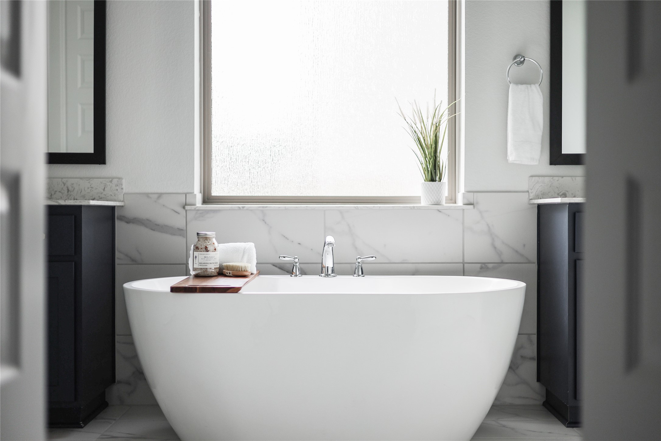 4905 Destination Way Jonestown, TX 78645 - Photo 8 of 27 a white bath tub sitting in a bathroom