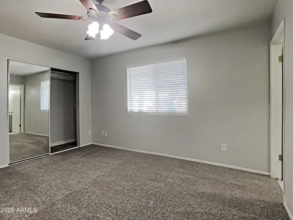 a view of an empty room with a window