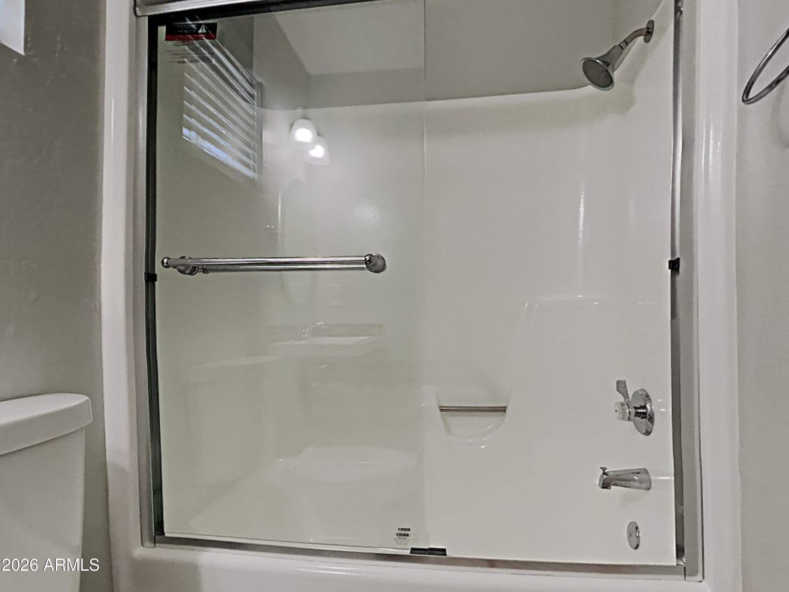 1001 West Villa Rita Drive Phoenix, AZ 85023 - Photo 15 of 26 a bathroom with a glass shower door