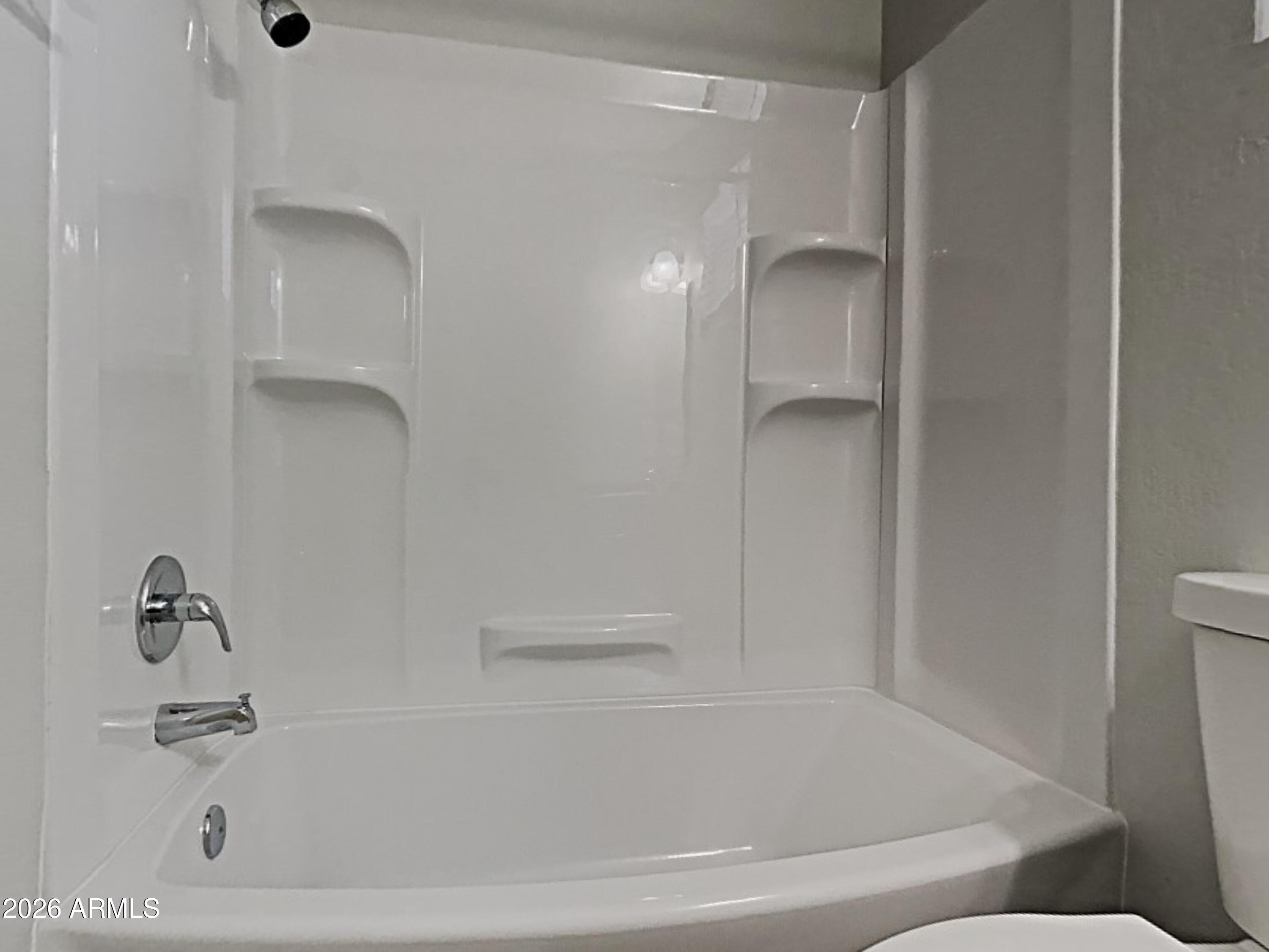 1001 West Villa Rita Drive Phoenix, AZ 85023 - Photo 17 of 26 a bathroom with a bathtub and a shower