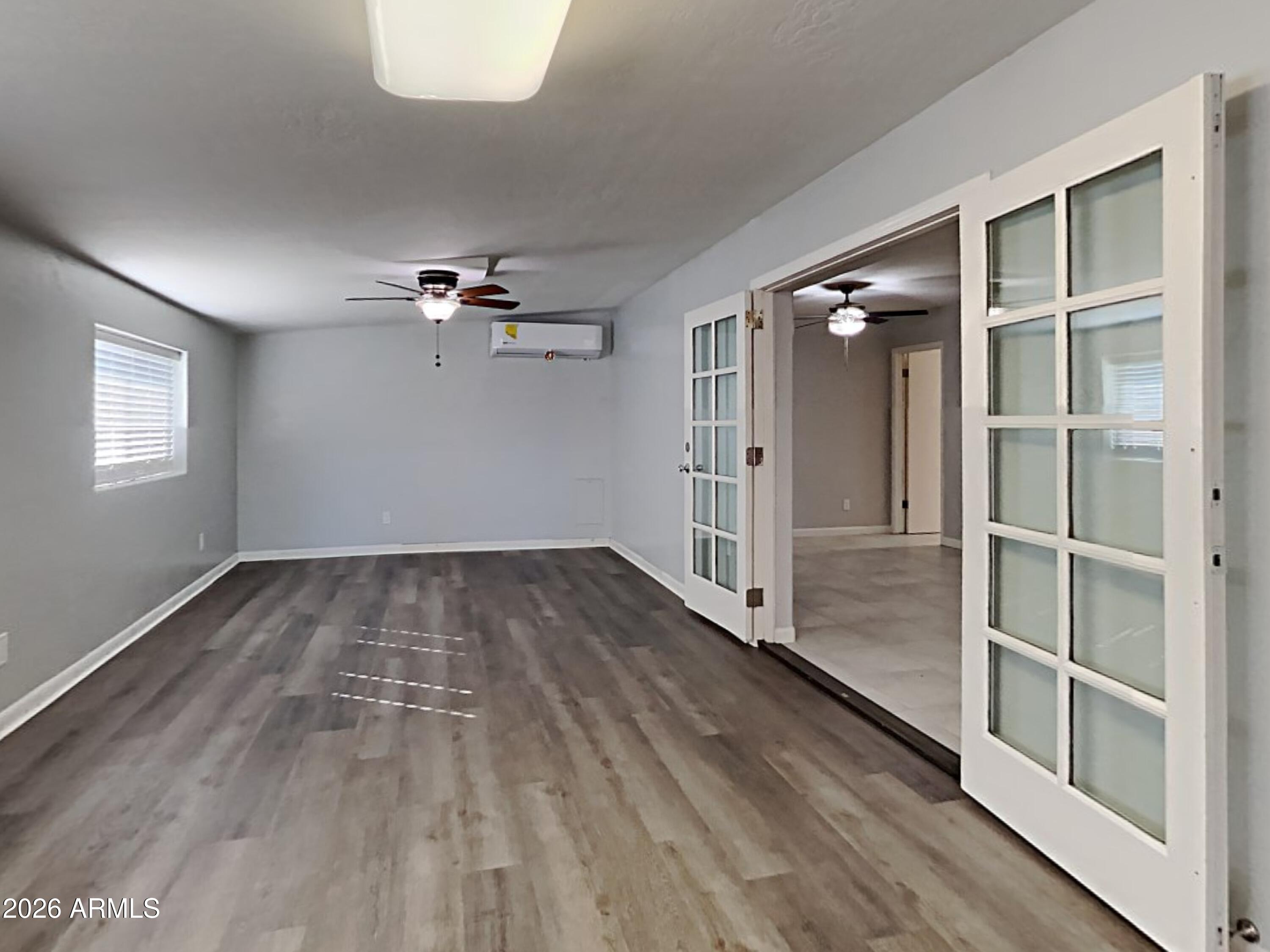 1001 West Villa Rita Drive Phoenix, AZ 85023 - Photo 22 of 26 wooden floor in an empty room with a window