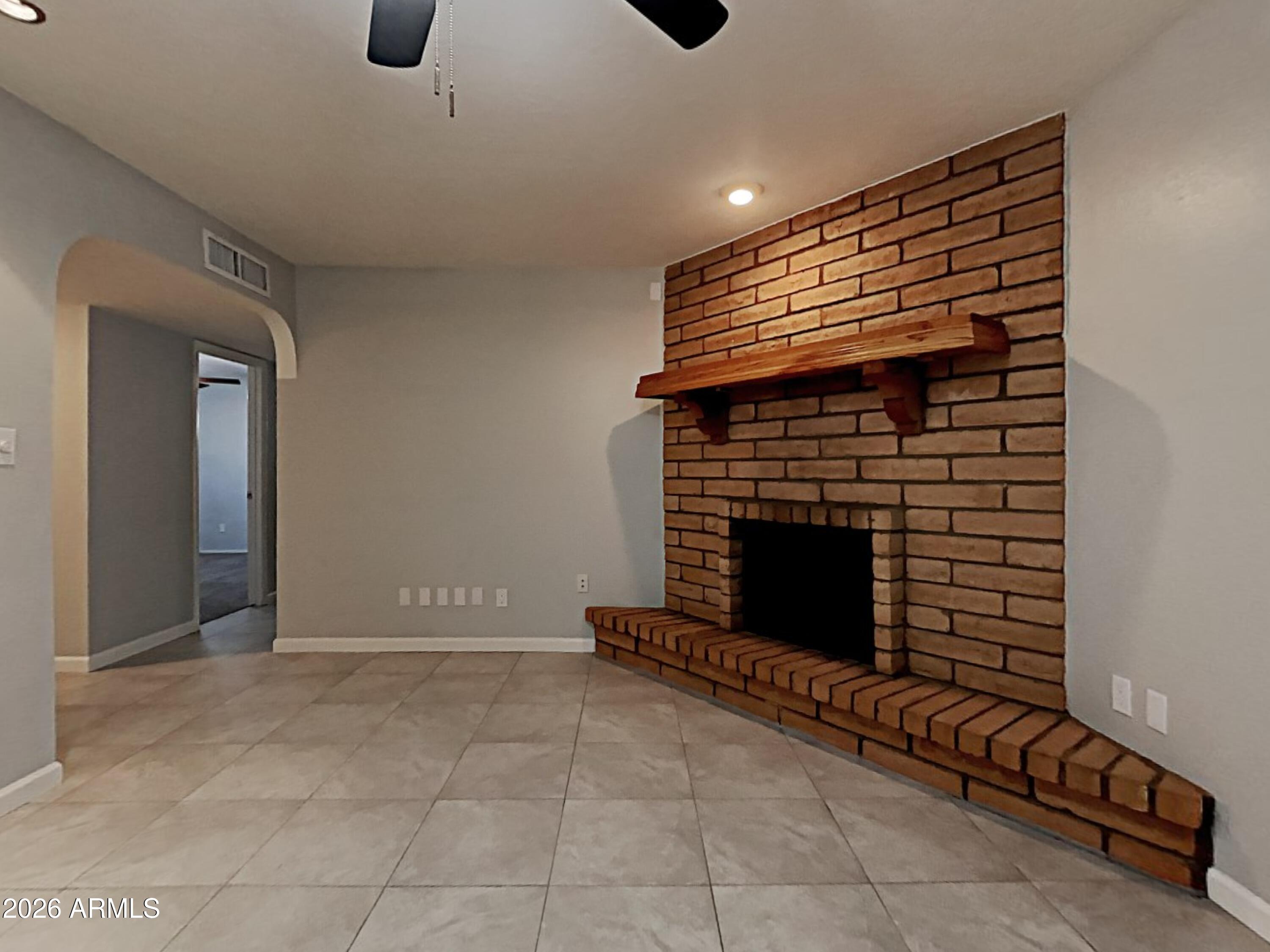 1001 West Villa Rita Drive Phoenix, AZ 85023 - Photo 4 of 26 a view of an empty room with a fireplace